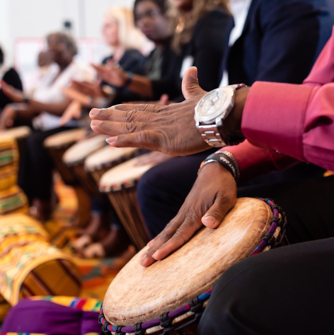hands-playing-drums-together-ceremony-diverse-group