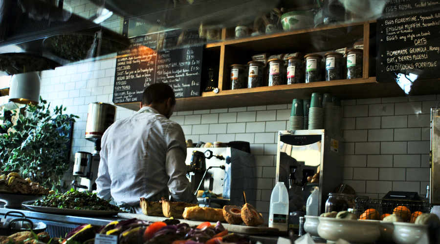 Kitchen worker busy at their job.