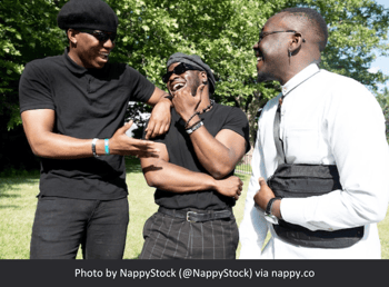 Photo by NappyStock of three Black men standing and conversing