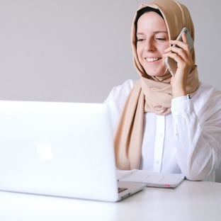 woman working in front of a laptop
