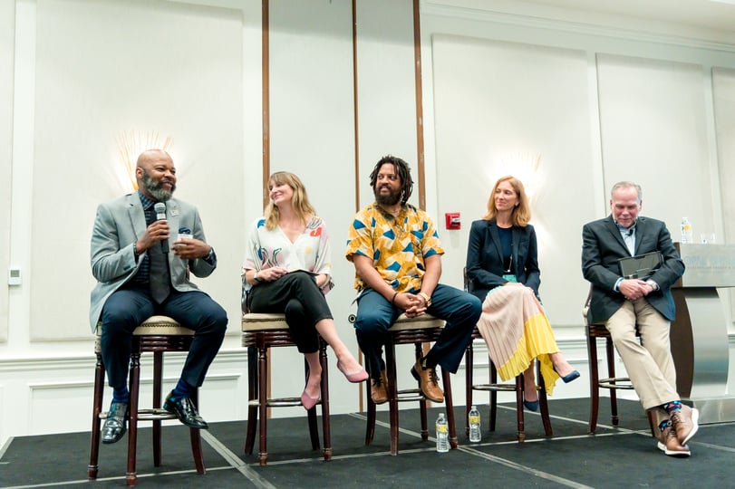 Photo of Tamarack Consulting Director of Community Engagement Lisa Attygalle onstage as part of a panel discussion