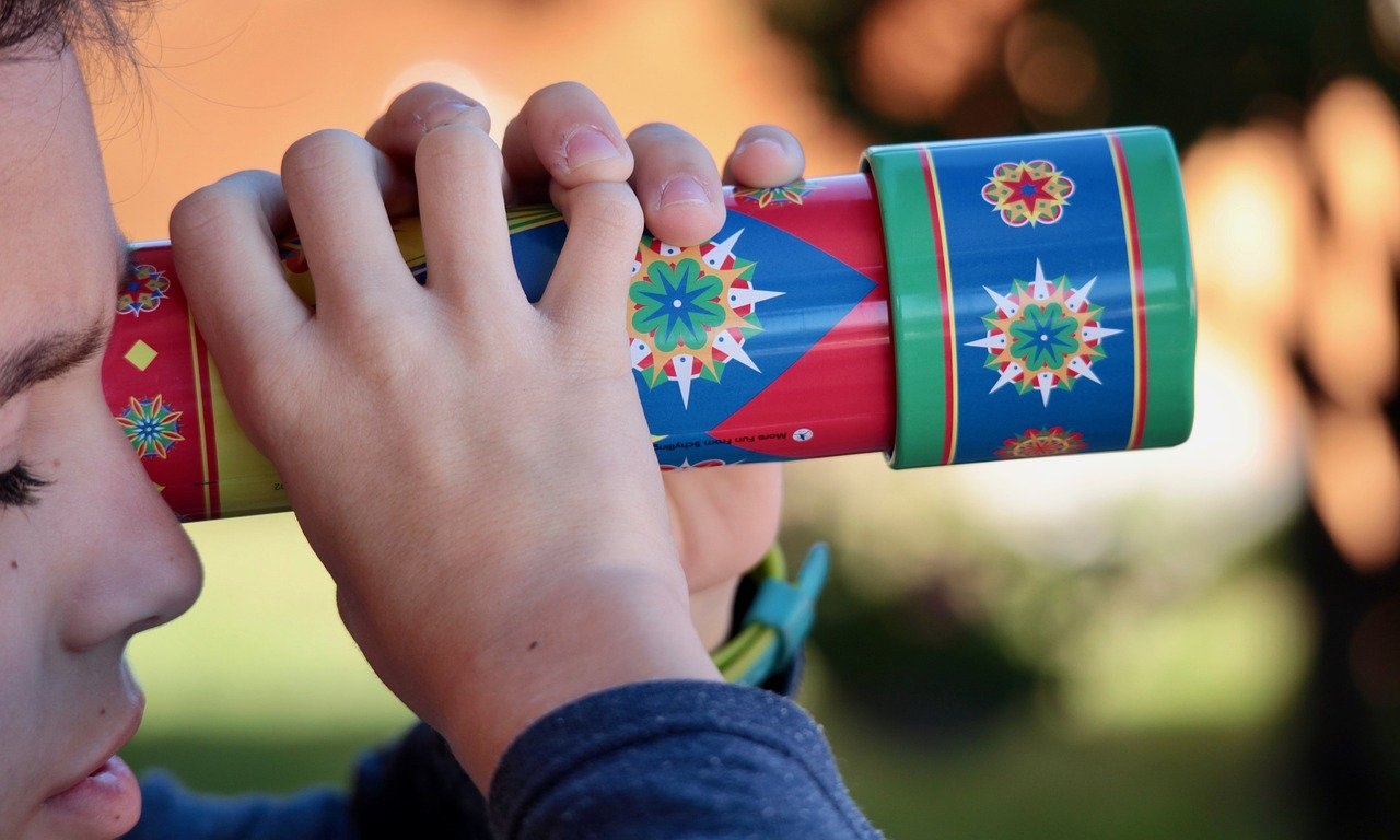 Child looking through kaleidoscope-682783-edited.jpg