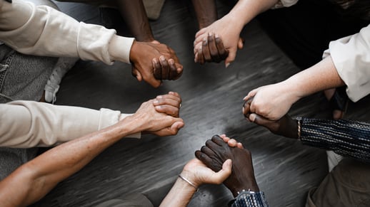 People of many races join hands