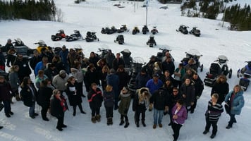 Gathering outside with snow mobiles.jpg