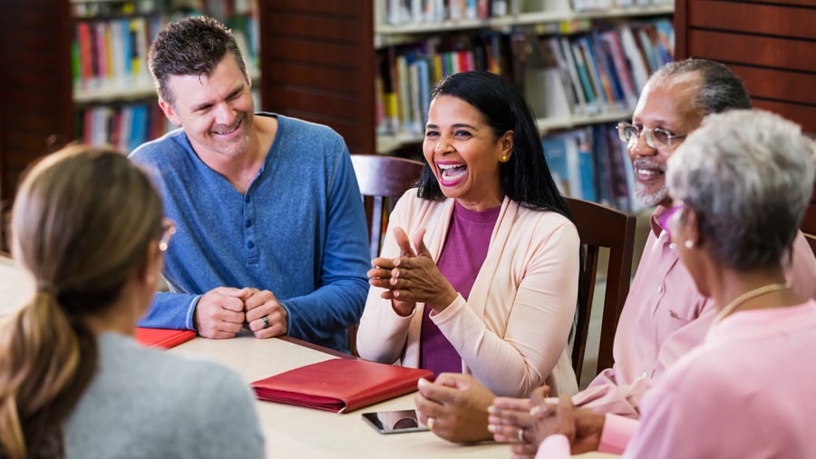 Group of people happily in a discussion