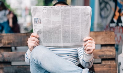 Man holding newspaper