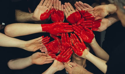 Hands with red paint