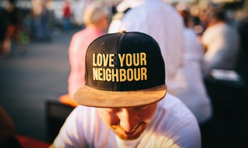 Man wearing love your neighbour hat-964767-edited