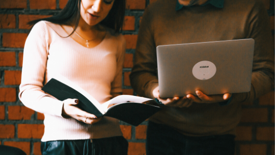 People standing with laptop