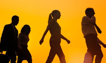 People walking orange background-604000-edited