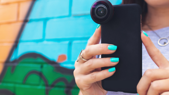 Person using cell phone to film