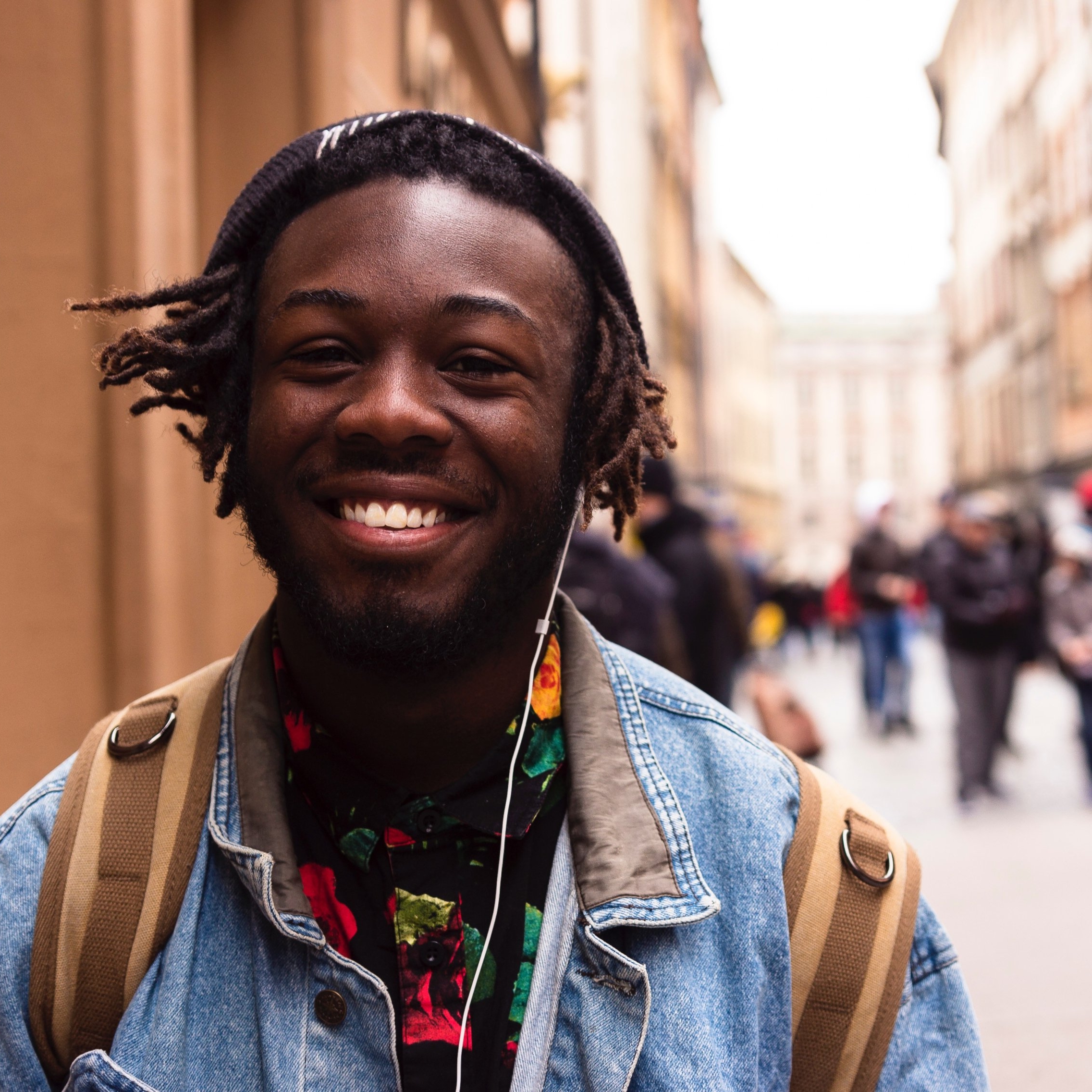 Young man in street with friends close up.jpg