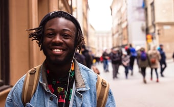 Young man in street with friends