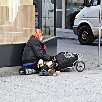 Poverty woman on street corner