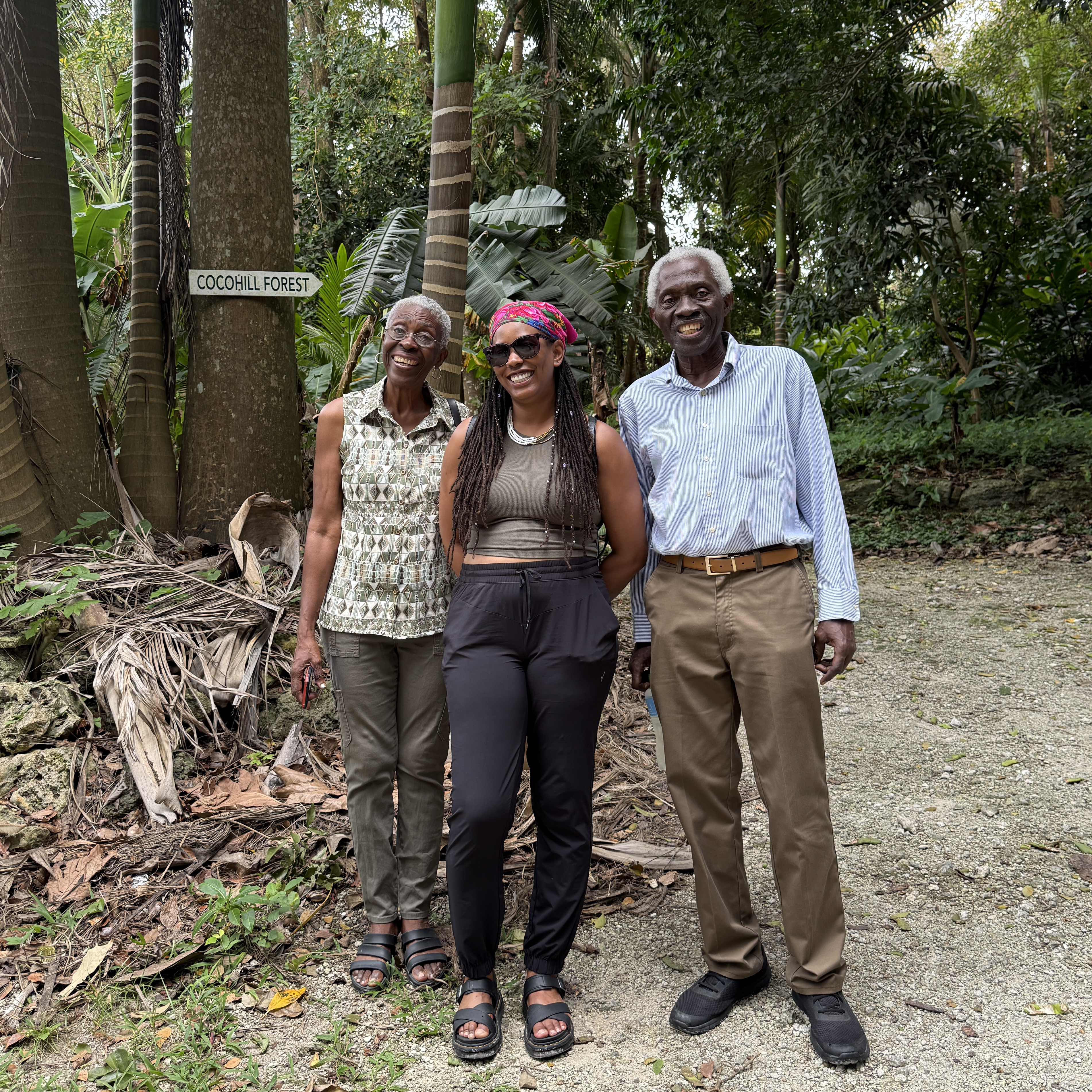 Rochelle with Dr. Laura Roberts-Nkrumah and Mr. Mabrak Nkrumah at the entrance to Cocohill Forest