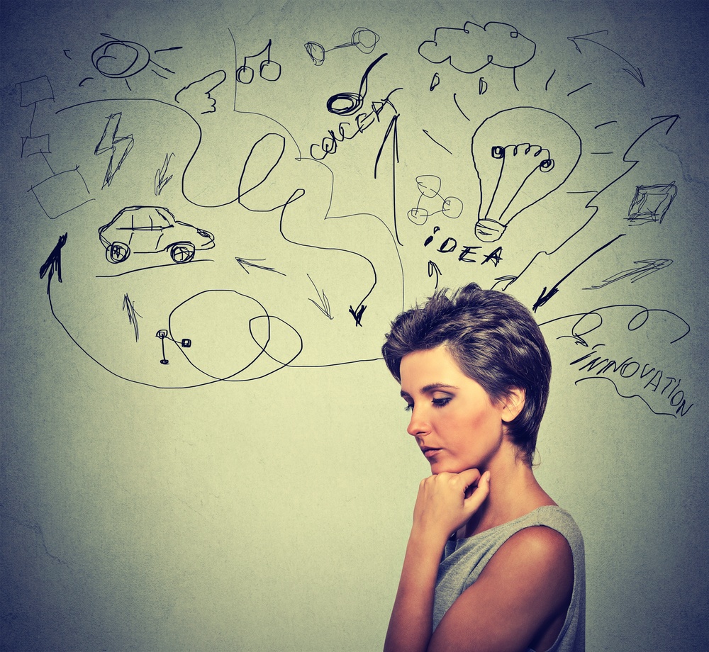 Portrait worried young woman thinking dreaming has many ideas looking down isolated grey wall background. Human emotions feelings life perception. Decision making process concept..jpeg