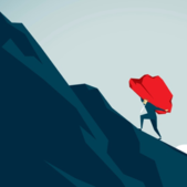 person carrying boulder up mountain