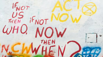 Image of graffiti: If not us, then who? If not now, then when?