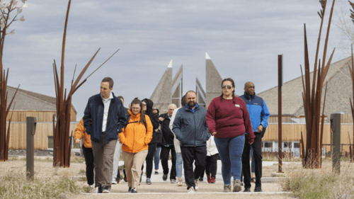 SPARKS 2024 participants walking and learning about the land around Wanuskewin.