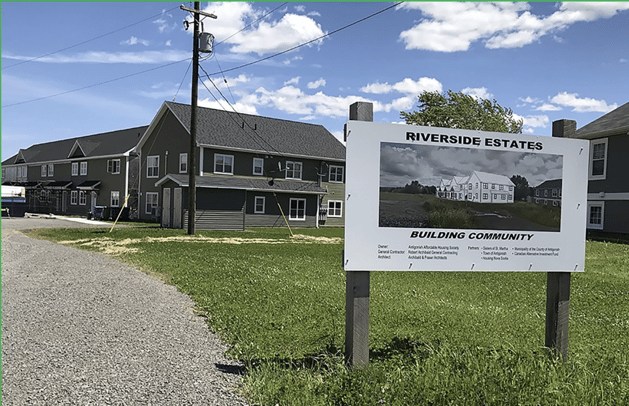 A sign in front of a building

Description automatically generated