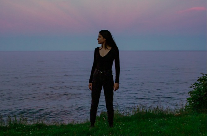 young-woman-sunset-horizon-land-sea