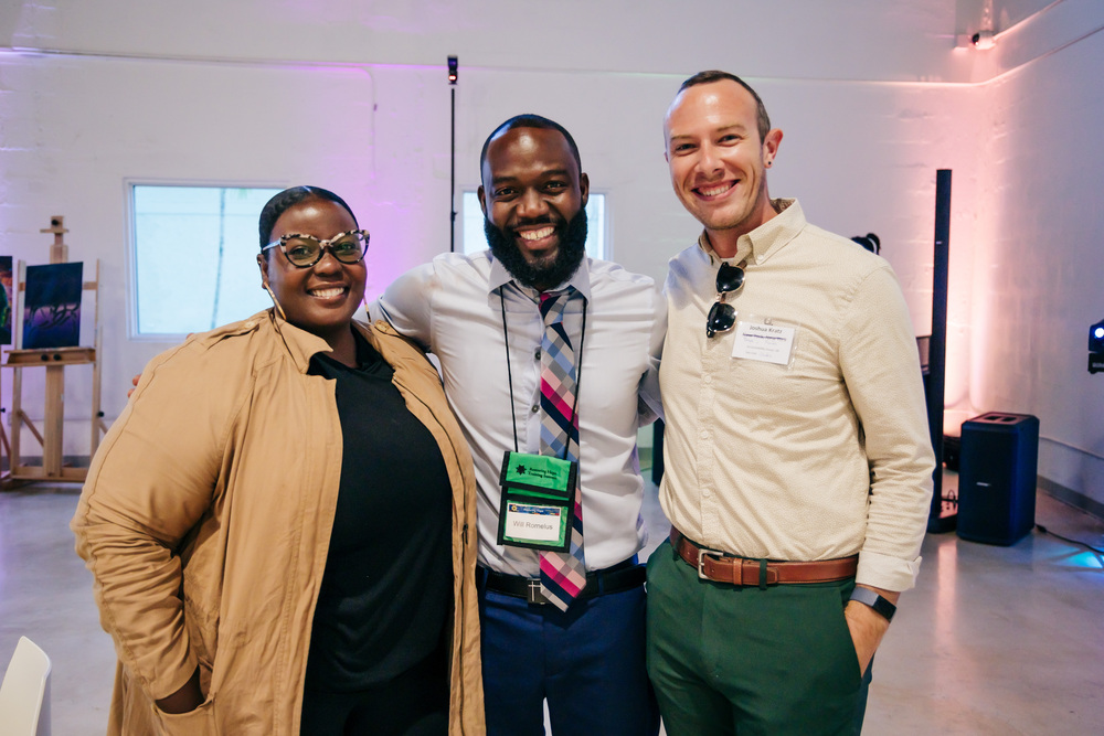 smiling-people-posing-together-networking-event-diversity