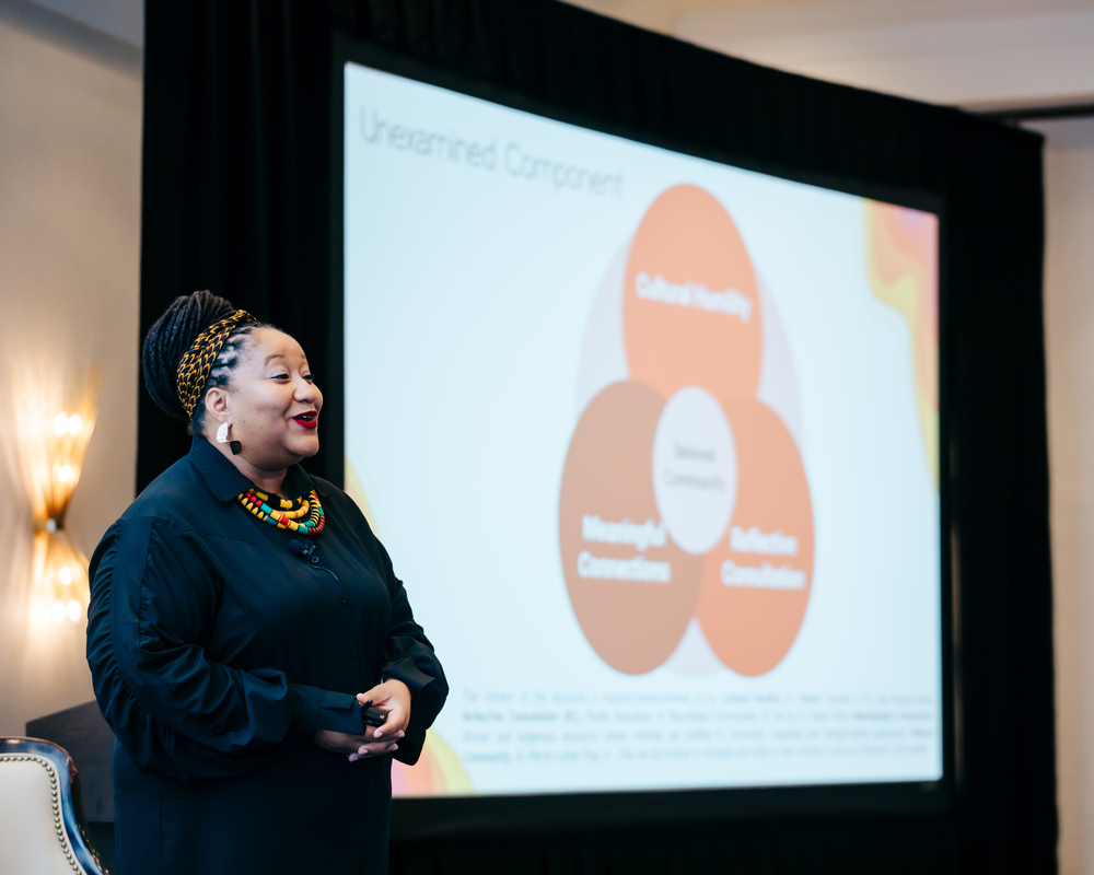 speaker-presenting-black-woman-smiling-confident-event