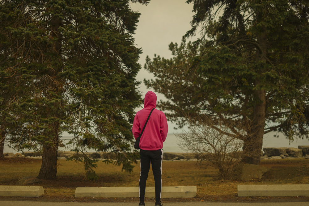 person-standing-facing-away-nature-landscape-trees-water person-standing-facing-away-nature-landscape-trees-water