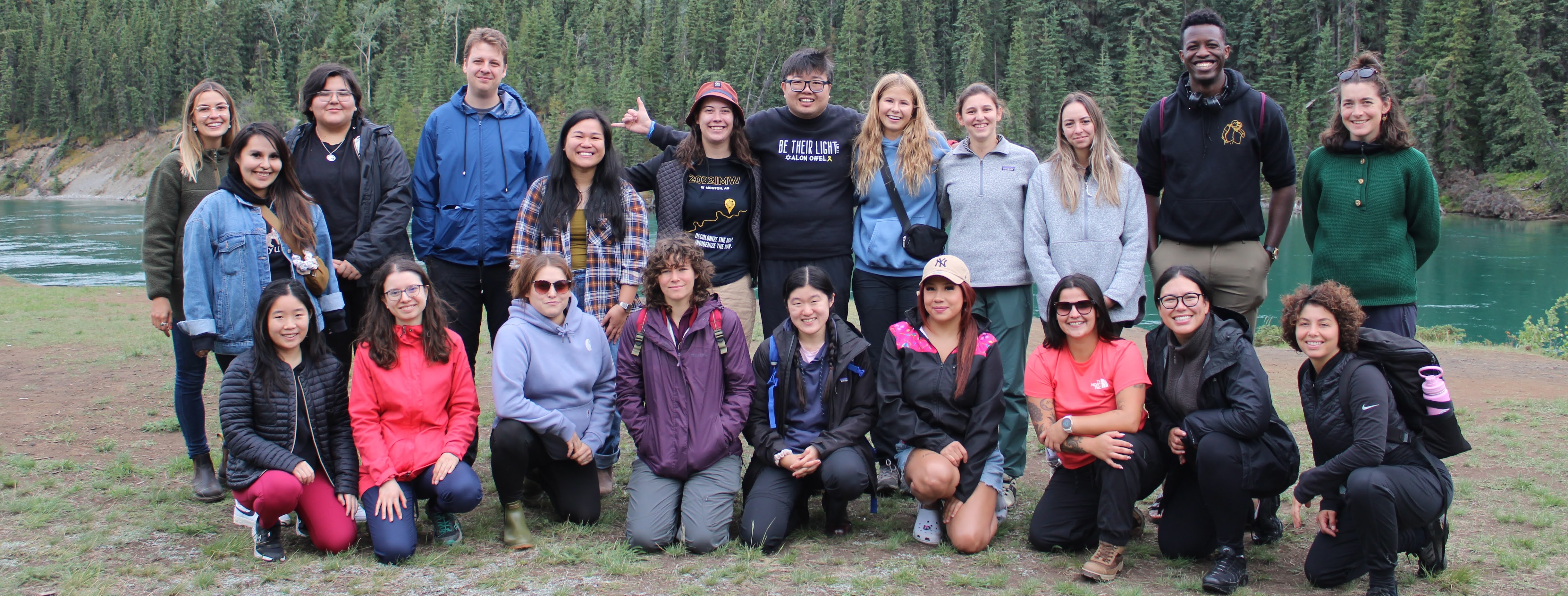 Howl attendees pose in front of a beautiful Yukon landscape