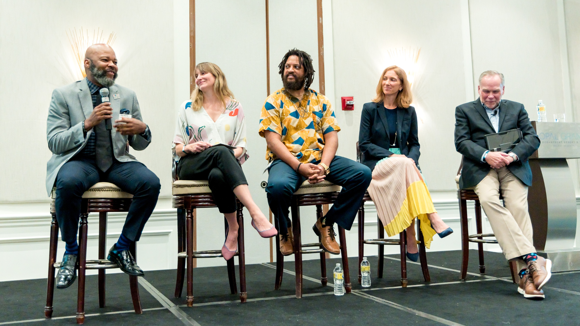Photo of Tamarack Consulting Director of Community Engagement Lisa Attygalle onstage as part of a panel discussion