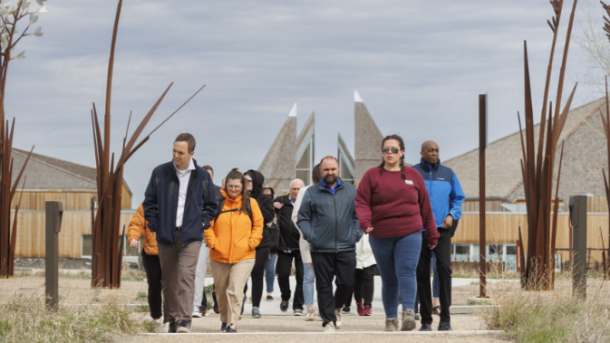 SPARKS 2024 participants walking and learning about the land around Wanuskewin.