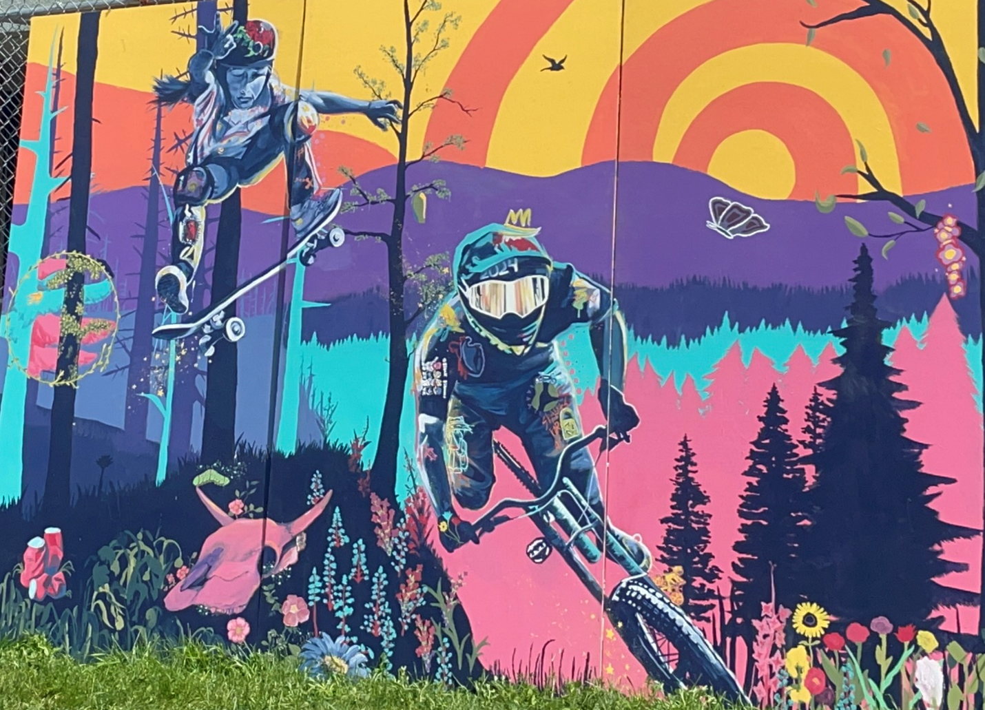 Colourful painting of individual riding bike through forest